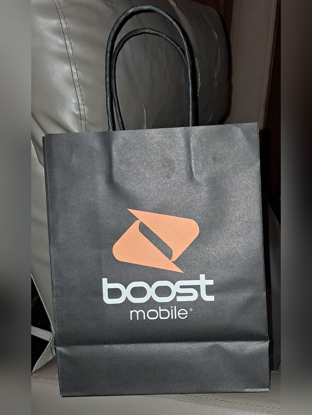 BOOST MOBILE BLACK PAPER BAGBOOST MOBILE BLACK PAPER BAG. About 8W x 10H x 3 7/8